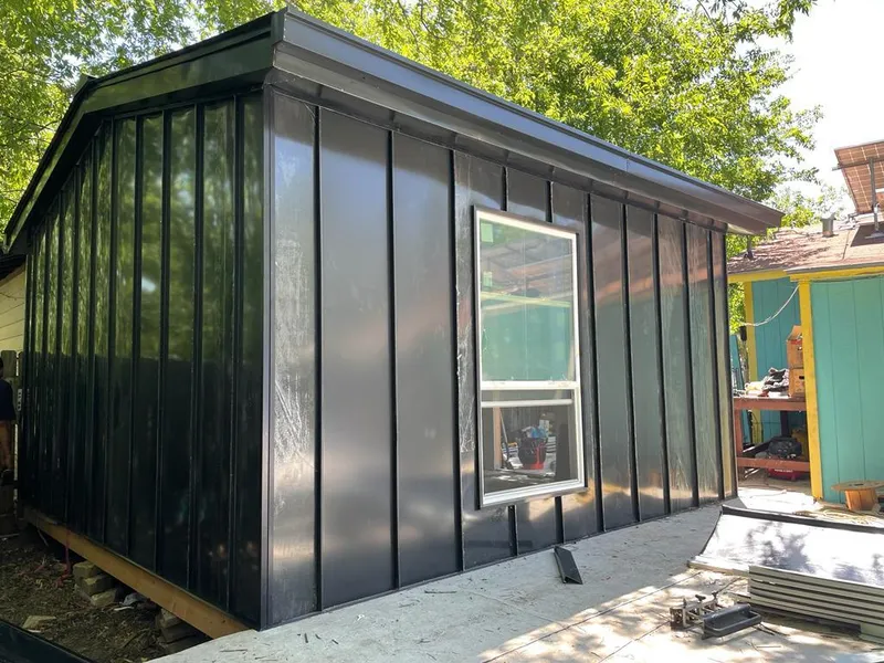 Black standing seam metal wall panels for Roof Inspection in Cloverly